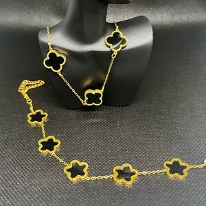 Elegant Gold and Black Clover Necklace